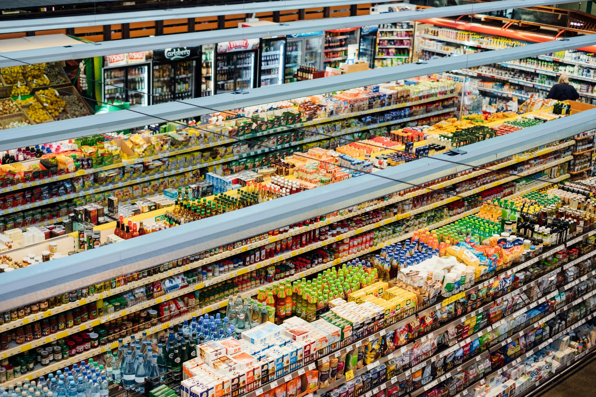 Shoppers and products illustrating omnichannel FMCG retail in the MENA region